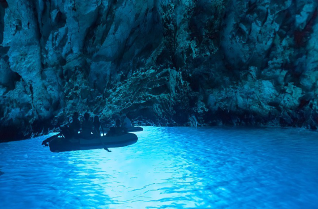 Blue Cave Croatia with glowing blue water inside the sea cave