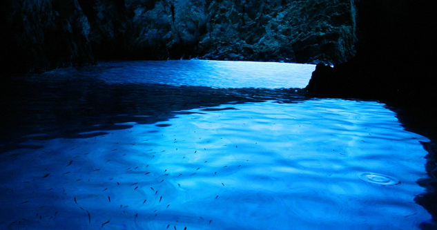 Blue Cave Croatia with glowing blue water inside the sea cave